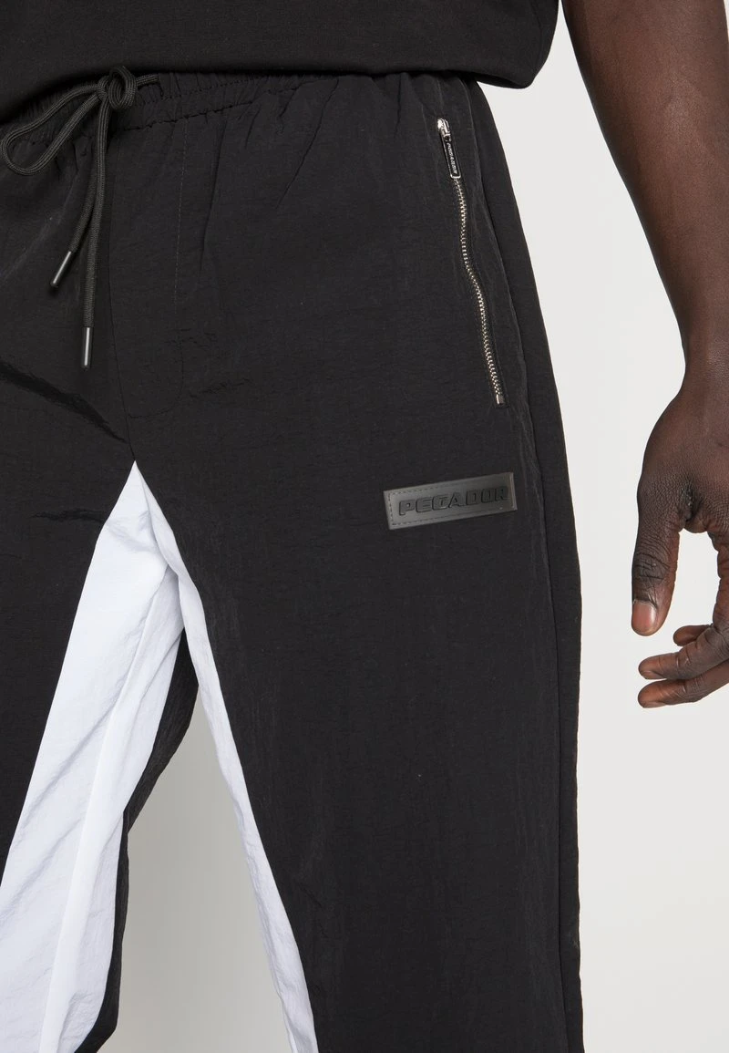 Pegador DEMERE WIDE TRACK PANTS UNISEX - Jogginghose - Black/white 7 Pegador DEMERE WIDE TRACK PANTS UNISEX - Jogginghose - Black/white – Bild 5