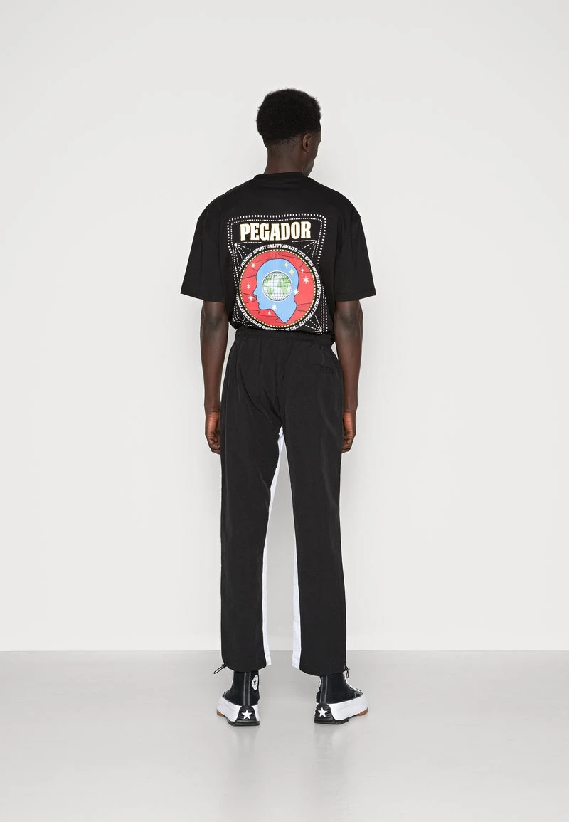 Pegador DEMERE WIDE TRACK PANTS UNISEX - Jogginghose - Black/white 5 Pegador DEMERE WIDE TRACK PANTS UNISEX - Jogginghose - Black/white – Bild 3